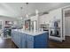 Bright kitchen with a large island, stainless steel appliances, and an open view to the dining area at 2077 Towne Mill Ave, Canton, GA 30114