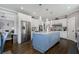 Spacious kitchen featuring a large blue island, stainless steel appliances, and a door leading outside at 2077 Towne Mill Ave, Canton, GA 30114