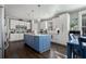 Modern kitchen featuring a blue island, stainless steel appliances, and ample cabinet space at 2077 Towne Mill Ave, Canton, GA 30114