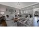 Bright living room features hardwood floors, and neutral-toned furniture at 2077 Towne Mill Ave, Canton, GA 30114