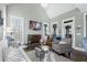 Bright living room with fireplace, vaulted ceiling, and natural lighting at 2077 Towne Mill Ave, Canton, GA 30114
