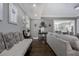 Neutral living room with hardwood floors, wainscoting, and contemporary artwork at 2077 Towne Mill Ave, Canton, GA 30114