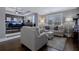 Main bedroom suite extends into sitting area with plush sofa, hardwood floors and lots of natural light at 2077 Towne Mill Ave, Canton, GA 30114