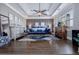 Spacious main bedroom suite with hardwood floors, stylish furnishings, and plenty of natural light at 2077 Towne Mill Ave, Canton, GA 30114