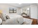 Bedroom showcasing neutral tones, plush carpet, and natural light filtering through a window at 7316 Caribou Trl, Riverdale, GA 30296