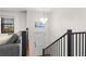 Bright entryway with stairs and a modern light fixture welcomes you to the open and airy living space at 7316 Caribou Trl, Riverdale, GA 30296