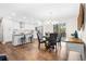 Bright kitchen featuring stainless steel appliances, a center island with bar seating, and stylish pendant lighting at 7316 Caribou Trl, Riverdale, GA 30296