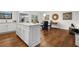 Open concept kitchen with a center island that flows into the dining area, perfect for gatherings at 7316 Caribou Trl, Riverdale, GA 30296