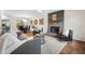 Spacious living room featuring a stone fireplace, hardwood floors and modern decor at 7316 Caribou Trl, Riverdale, GA 30296