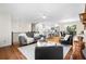 Inviting living space seamlessly connects living room, dining area, and kitchen, perfect for modern living at 7316 Caribou Trl, Riverdale, GA 30296