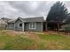 Spacious backyard with a lush green lawn and mature trees at 1007 Billy Mcgee Rd, Lawrenceville, GA 30045