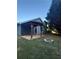 Backyard patio area with pergola and a stone fire pit, perfect for entertaining at 1007 Billy Mcgee Rd, Lawrenceville, GA 30045