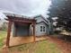 Backyard patio with wooden pergola and privacy fence at 1007 Billy Mcgee Rd, Lawrenceville, GA 30045