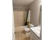 Cozy bathroom featuring a shower and bathtub combination, with a toilet and vanity sink at 1007 Billy Mcgee Rd, Lawrenceville, GA 30045
