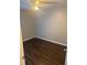 Cozy bedroom featuring modern wood-look flooring, ceiling fan, and neutral wall color at 1007 Billy Mcgee Rd, Lawrenceville, GA 30045