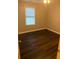 Cozy bedroom with wood-look floors and natural light, perfect for creating a relaxing retreat at 1007 Billy Mcgee Rd, Lawrenceville, GA 30045