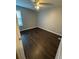 Bedroom with neutral walls, a ceiling fan, and a large window at 1007 Billy Mcgee Rd, Lawrenceville, GA 30045