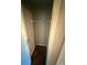 View of a closet space with neutral paint, a wire shelf and hardwood flooring at 1007 Billy Mcgee Rd, Lawrenceville, GA 30045
