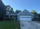 Charming single-story home featuring a well-manicured front lawn and attached two-car garage at 1007 Billy Mcgee Rd, Lawrenceville, GA 30045
