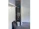 Image of the water heater in the garage featuring built-in storage at 1007 Billy Mcgee Rd, Lawrenceville, GA 30045