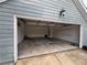 Spacious two-car garage with an open door and clean concrete floor at 1007 Billy Mcgee Rd, Lawrenceville, GA 30045