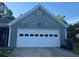 Spacious two-car garage door with traditional panel design at 1007 Billy Mcgee Rd, Lawrenceville, GA 30045