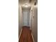 Hallway with wood-look flooring and neutral walls at 1007 Billy Mcgee Rd, Lawrenceville, GA 30045