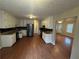 Spacious kitchen with granite countertops, stainless steel appliances, and wood flooring at 1007 Billy Mcgee Rd, Lawrenceville, GA 30045