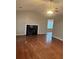 Open living room with a modern fireplace and lots of natural light at 1007 Billy Mcgee Rd, Lawrenceville, GA 30045