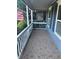 Inviting covered porch with decorative tile flooring, white railings, and natural light at 1007 Billy Mcgee Rd, Lawrenceville, GA 30045