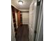Spacious walk-in closet with custom shelving and dark wood-look flooring at 1007 Billy Mcgee Rd, Lawrenceville, GA 30045