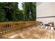 Spacious wood deck with outdoor seating area and scenic views of the lush green surroundings at 1312 Stanley Park Dr, Decatur, GA 30033