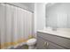 Bathroom with grey and yellow shower curtain at 1312 Stanley Park Dr, Decatur, GA 30033