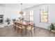 Dining room with hardwood floors, modern decor, neutral paint, and natural light at 1312 Stanley Park Dr, Decatur, GA 30033