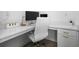Bright home office with a white desk, comfortable chair, and minimalist decor at 1312 Stanley Park Dr, Decatur, GA 30033