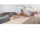 Cozy living room features a gray sectional, modern wood chairs, and lots of natural light at 1312 Stanley Park Dr, Decatur, GA 30033