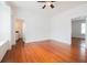 Bright bedroom featuring hardwood floors, white walls, and a ceiling fan at 338 Clifford Ne Ave, Atlanta, GA 30317