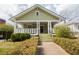 Charming green craftsman home with a cozy front porch and well-maintained landscaping at 338 Clifford Ne Ave, Atlanta, GA 30317