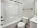 Bathroom featuring a white bathtub with shower, toilet, vanity, and black hardware at 2461 Sycamore Nw Rd, Atlanta, GA 30318