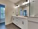 Bright bathroom features a double sink vanity, large mirror, and tiled shower, exuding modern elegance at 2461 Sycamore Nw Rd, Atlanta, GA 30318