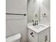 Bathroom featuring a white sink, vanity, mirror, and black hardware at 2461 Sycamore Nw Rd, Atlanta, GA 30318