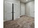 Bedroom with carpet and multiple doors, including a closet, providing ample storage space at 2461 Sycamore Nw Rd, Atlanta, GA 30318