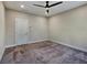 Bedroom featuring a ceiling fan, carpeted floors and white door at 2461 Sycamore Nw Rd, Atlanta, GA 30318