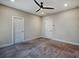 Bedroom featuring a ceiling fan, carpeted floors and bright white doors at 2461 Sycamore Nw Rd, Atlanta, GA 30318