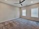 Bedroom featuring a ceiling fan, carpeted floors and natural light from the window at 2461 Sycamore Nw Rd, Atlanta, GA 30318