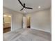Bedroom with neutral walls, carpet flooring, a modern fan, and bathroom access at 2461 Sycamore Nw Rd, Atlanta, GA 30318