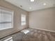 Bedroom with plush carpeting, natural light from windows, and neutral walls for a serene feel at 2461 Sycamore Nw Rd, Atlanta, GA 30318