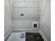 Compact laundry room with essential hookups and storage, ready for washer and dryer at 2461 Sycamore Nw Rd, Atlanta, GA 30318