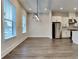 Spacious living room featuring hardwood floors, recessed lighting, and multiple windows at 2461 Sycamore Nw Rd, Atlanta, GA 30318