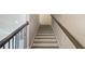Staircase with a contemporary design, featuring contrasting treads and risers and stylish railings at 2461 Sycamore Nw Rd, Atlanta, GA 30318